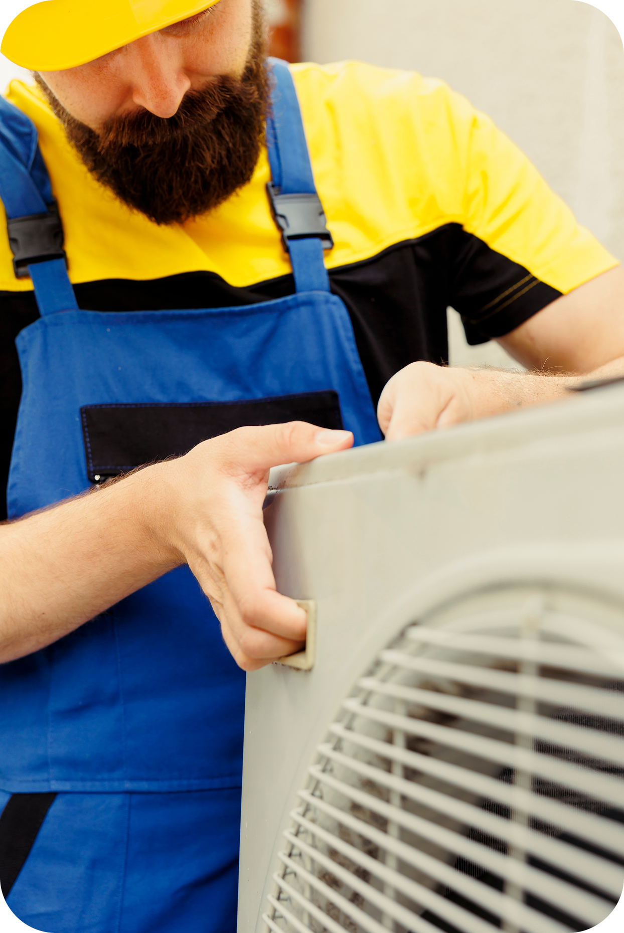 Repairman installing AC condenser
